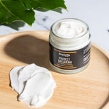 open pot of superfly protect day cream